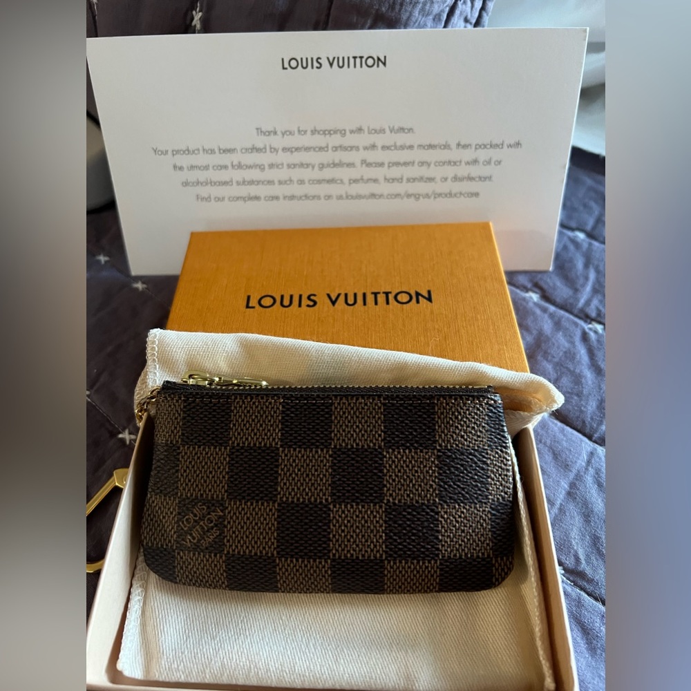 Authentic Louis Vuitton key/pouch with papers/ dust bag/box